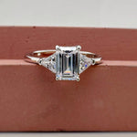 Load image into Gallery viewer, 1.00ct Emerald Cut Moissanite Engagement Ring, Emerald Cut with Trapezoid Accent Stones, Genuine Moissanite GRA Certified, 3 Stone Ring