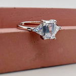 Load image into Gallery viewer, 1.00ct Emerald Cut Moissanite Engagement Ring, Emerald Cut with Trapezoid Accent Stones, Genuine Moissanite GRA Certified, 3 Stone Ring